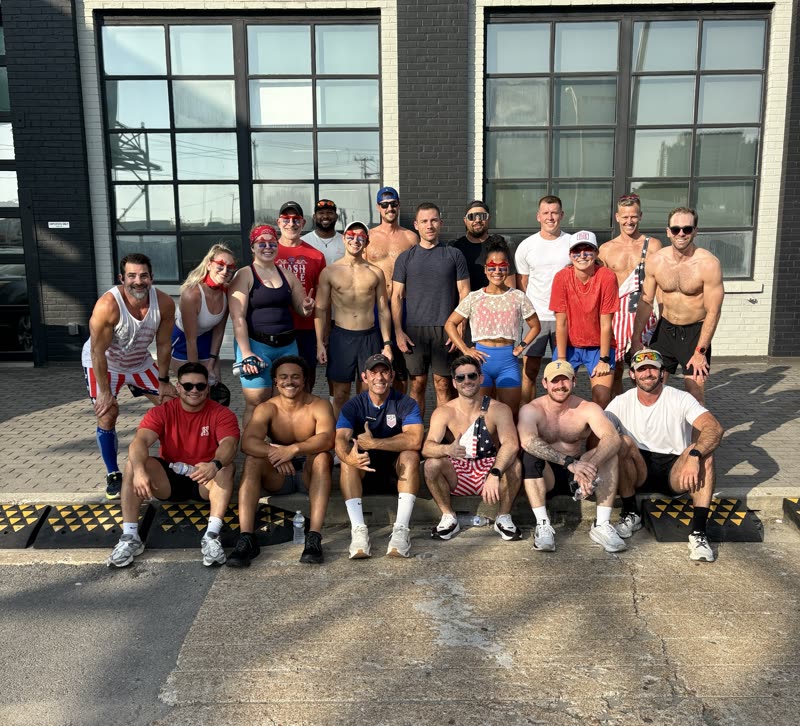 A large QNTM Run Club turnout gathered outside the gym in Nashville
